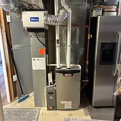 Completed Lennox high-efficiency furnace installation in a Calgary mechanical room